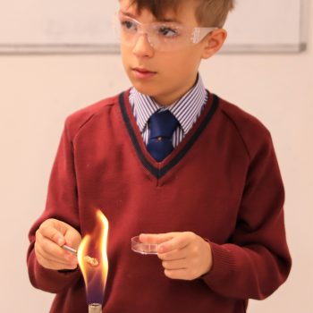 schoolboy using a bunsen burner