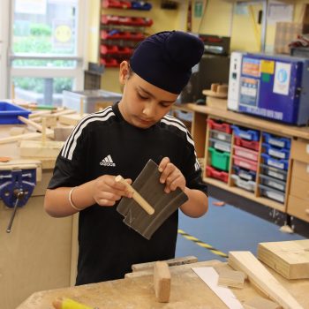 a child in a wood work lesson at a boys school in Chesham