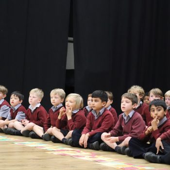 children sitting and listening attentively