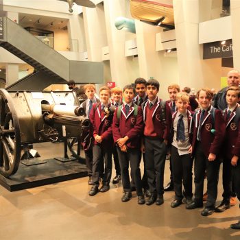 Students stood next to mortars in a museum