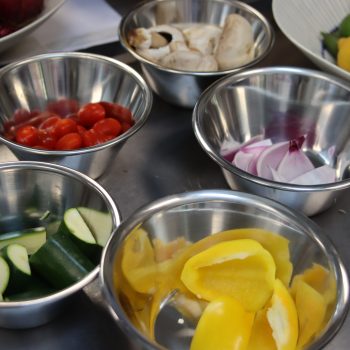 Vegetables cut up into bowls