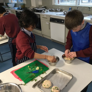 Students rolling out fish cakes