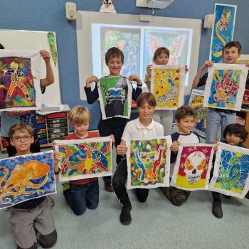 students showing off their copaintings