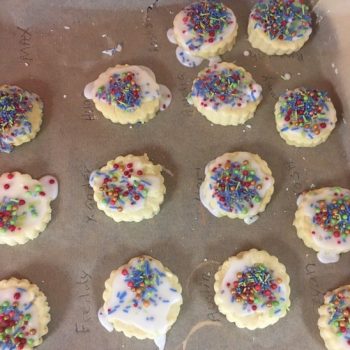 sugar cookies with sprinkles on a tray