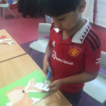 child cutting up paper