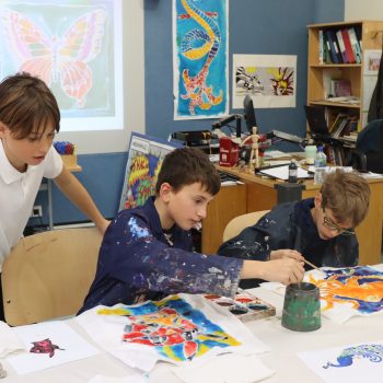 3 students painting