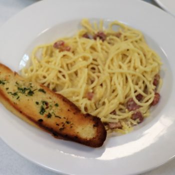 Pasta with garlic bread on the side
