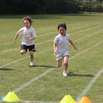 boys running across the field