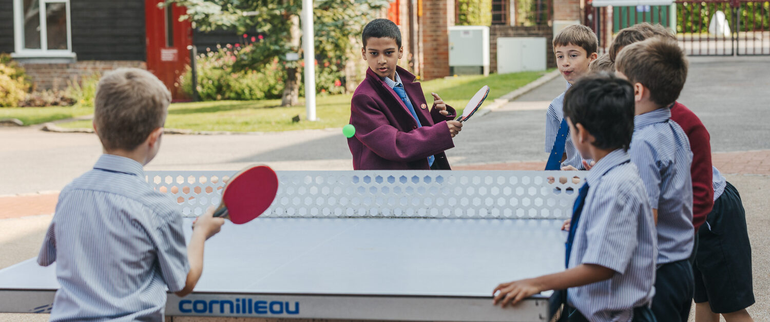students playing ping pong