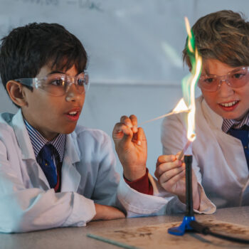 students using a bunsen burner